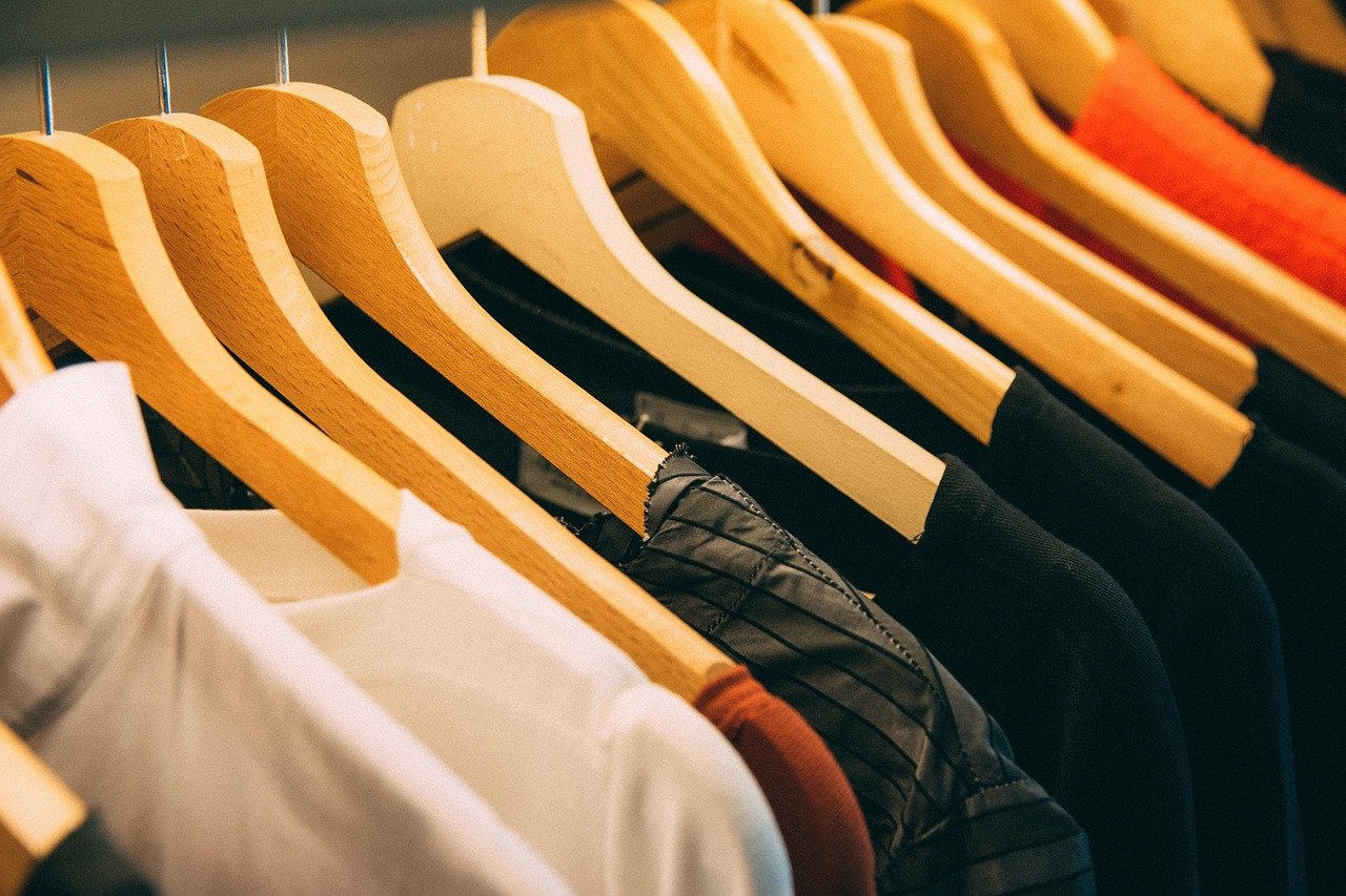 Closet or pantry with small, discreet neutral-toned labels on bins, no large or colorful lettering