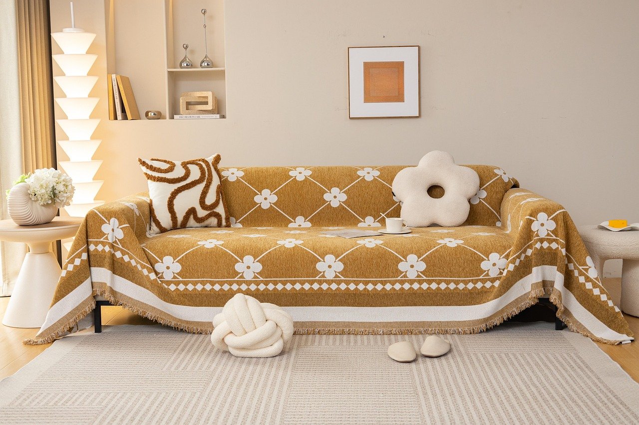 Living room storage ottoman with lid open showing blankets inside, doubling as a coffee table