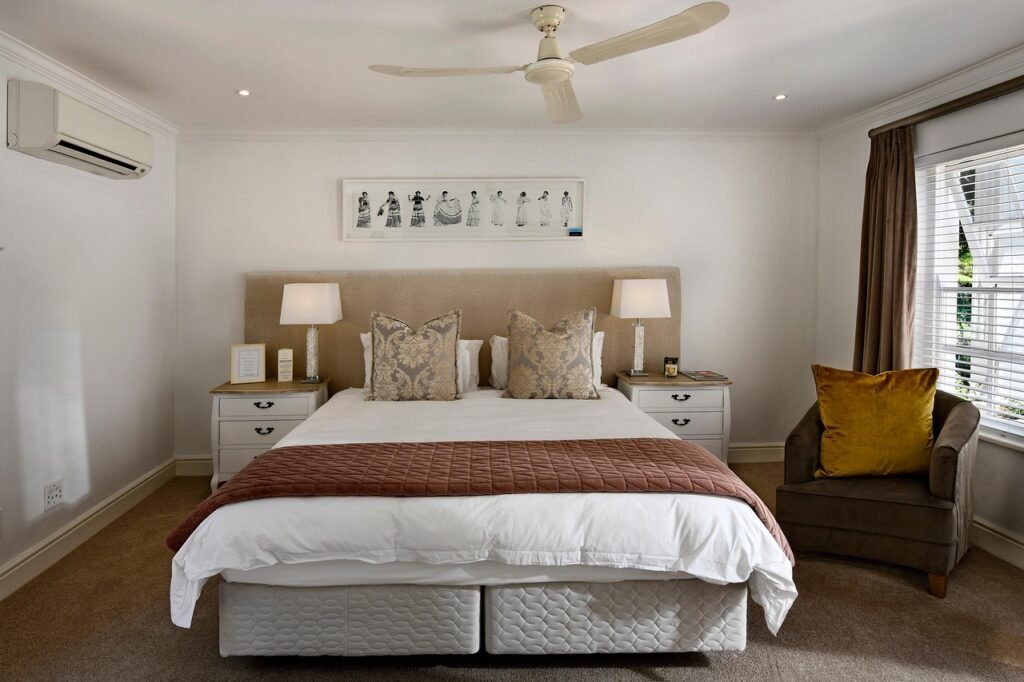 Styled college dorm room with coordinated bedding and string lights