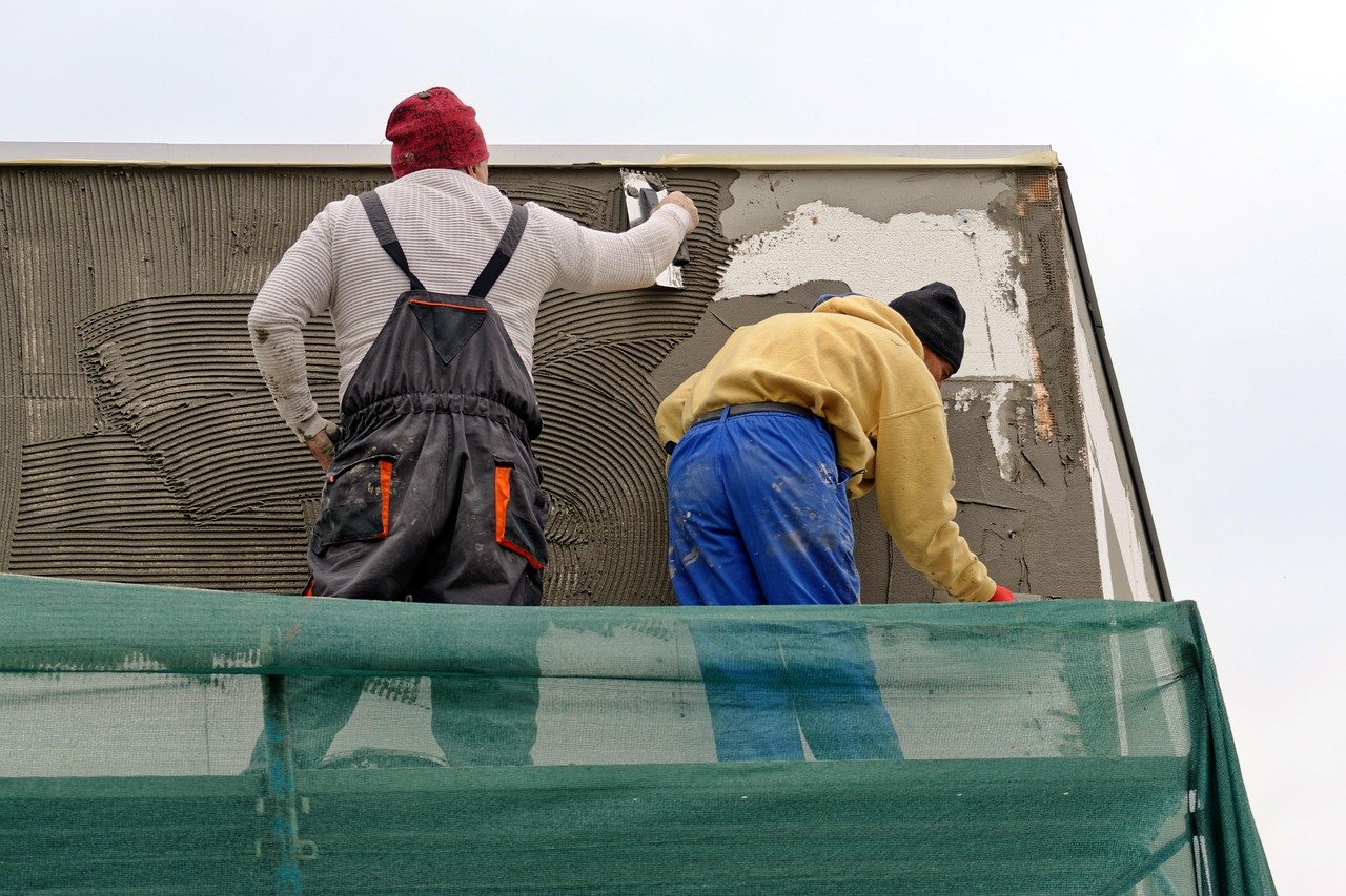 Applying and burnishing plaster on a wall