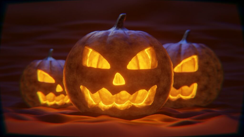 Halloween porch decorated with lit jack-o-lanterns at night