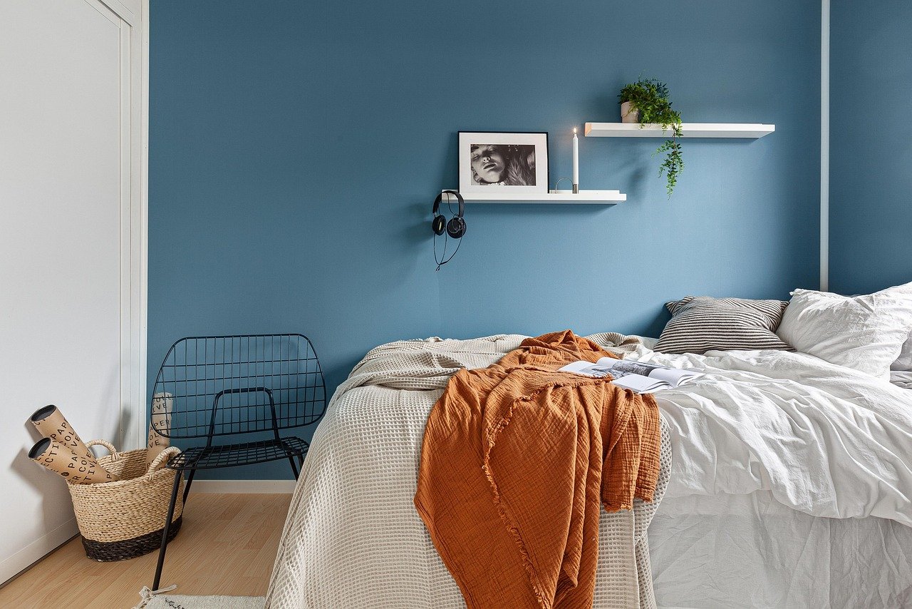 Neatly made bed in natural light
