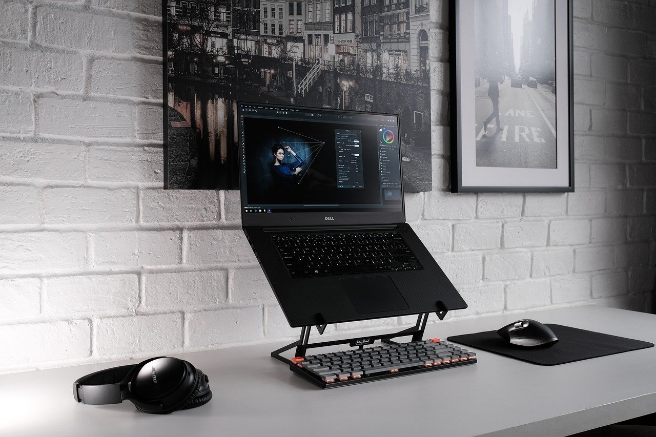 Small home office desk with laptop and clean surface