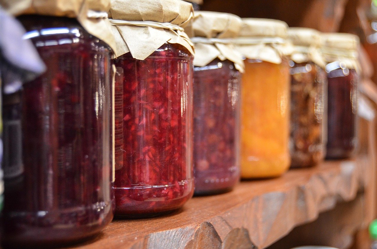 Glass jars filled with preserves on a shelf