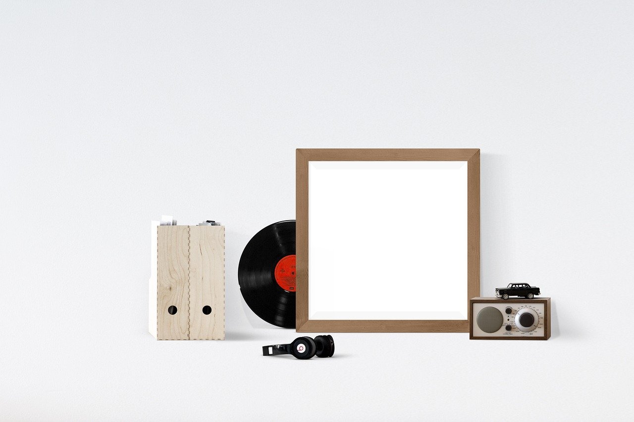 Asymmetric gallery wall with mismatched frame sizes and colors