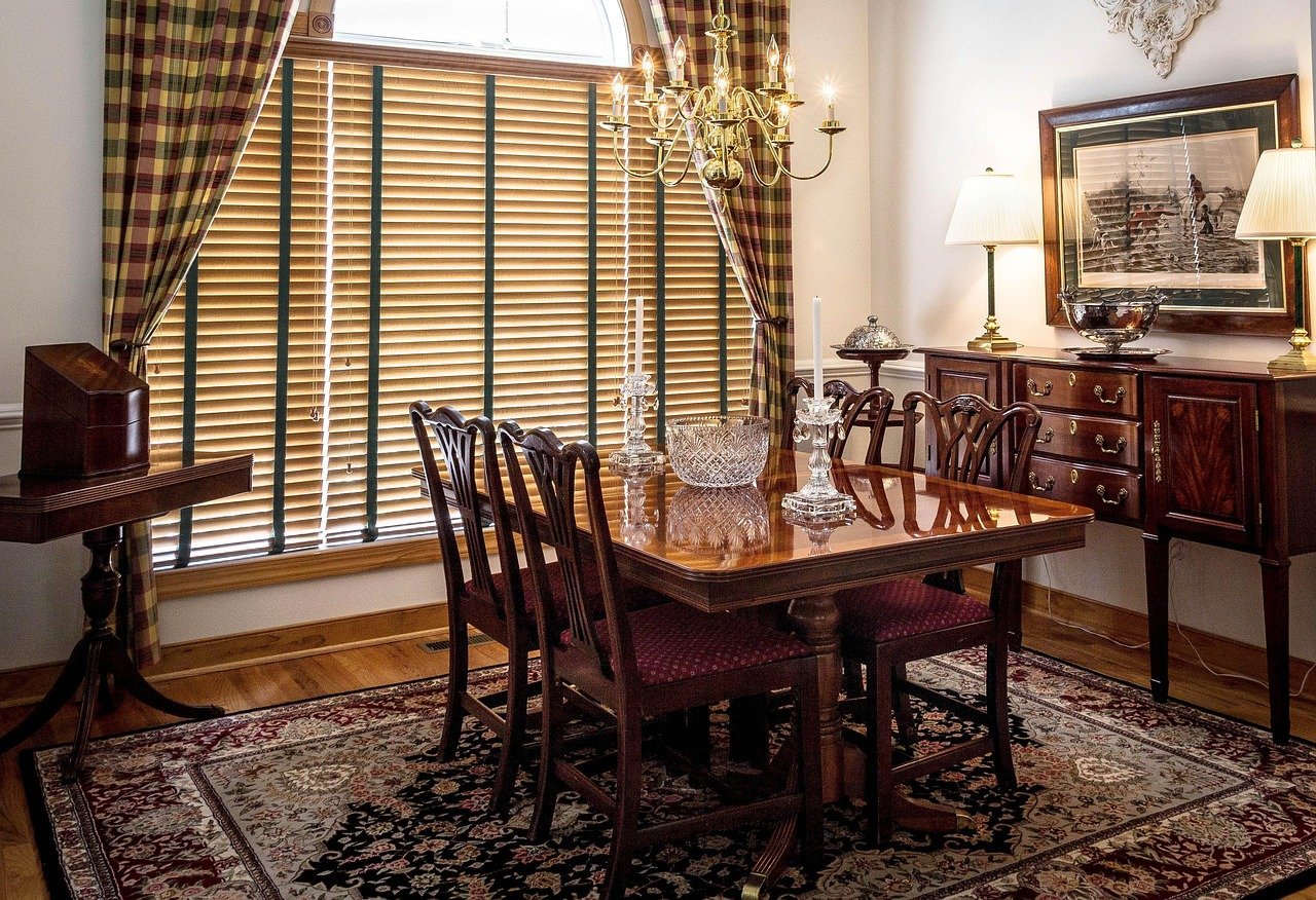 Round dining table with upholstered chairs