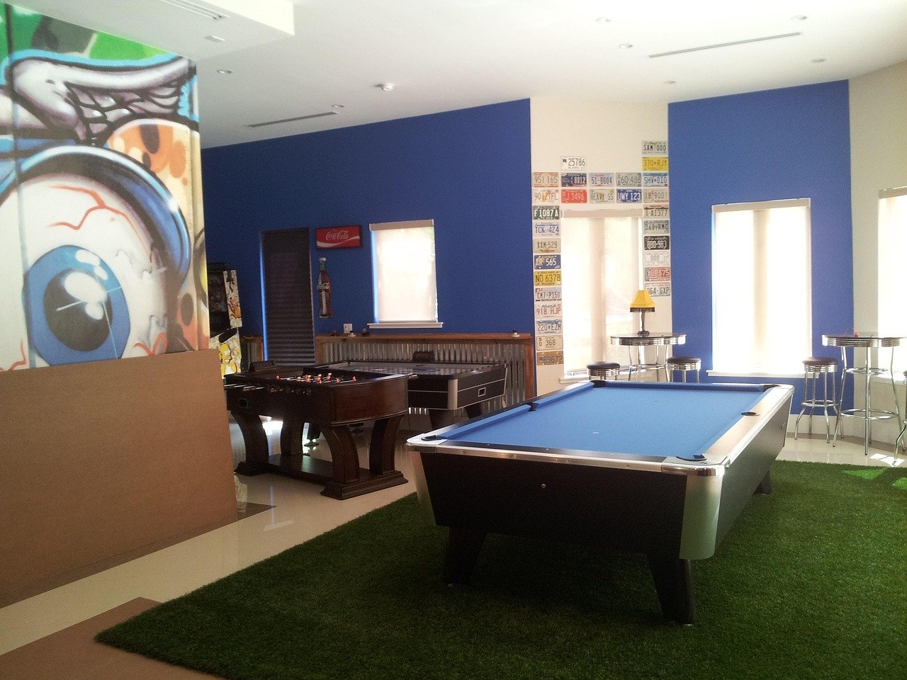 Game room with bar and billiards table