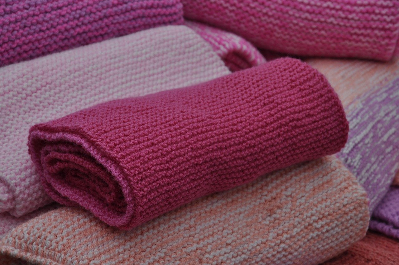 Folded fabric items compressed for storage