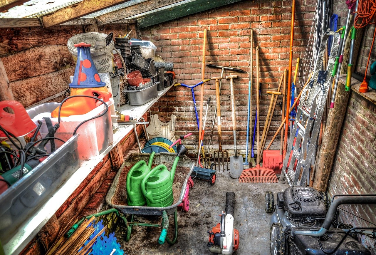 Garden shed with tools and equipment organized along the wall