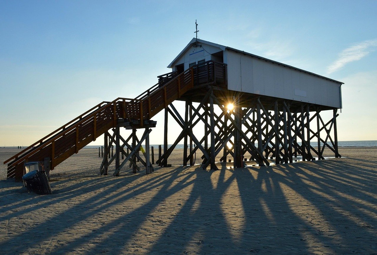 House elevated on tall stilts at the beach