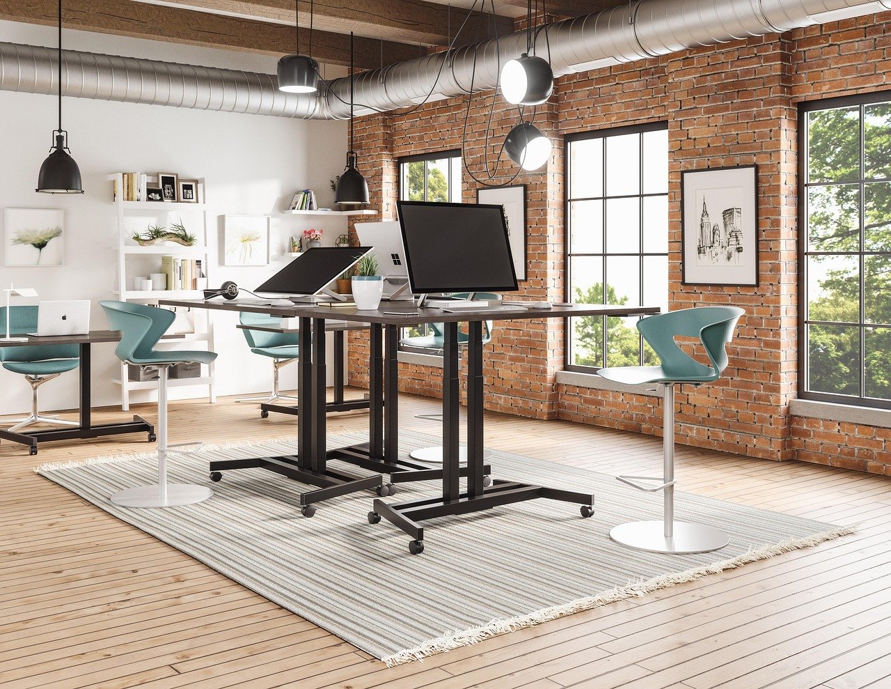 Standing desk converter placed on top of a regular desk, monitor and keyboard raised