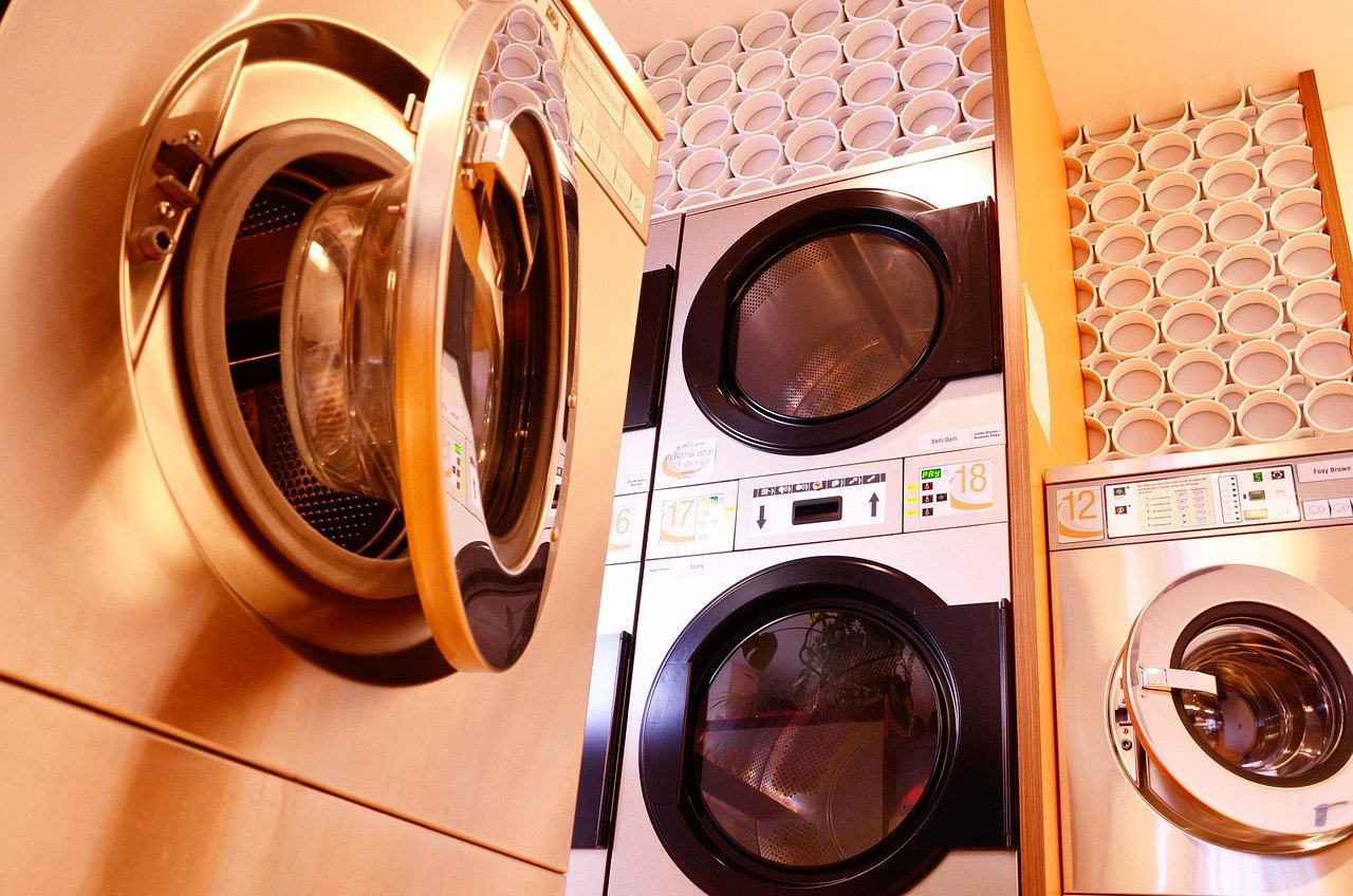 Close-up of a dryer drum door at a laundromat