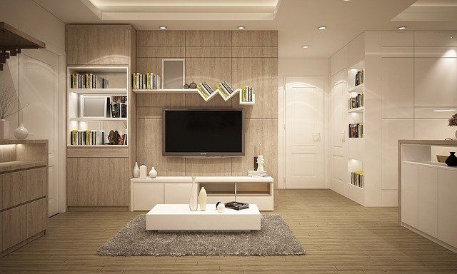 Finished accent wall painted white, viewed from across a naturally lit living room