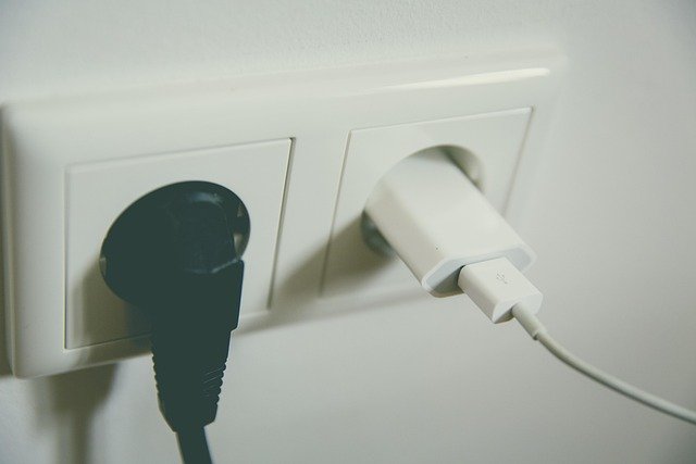 Plug-in fly trap device in a wall outlet