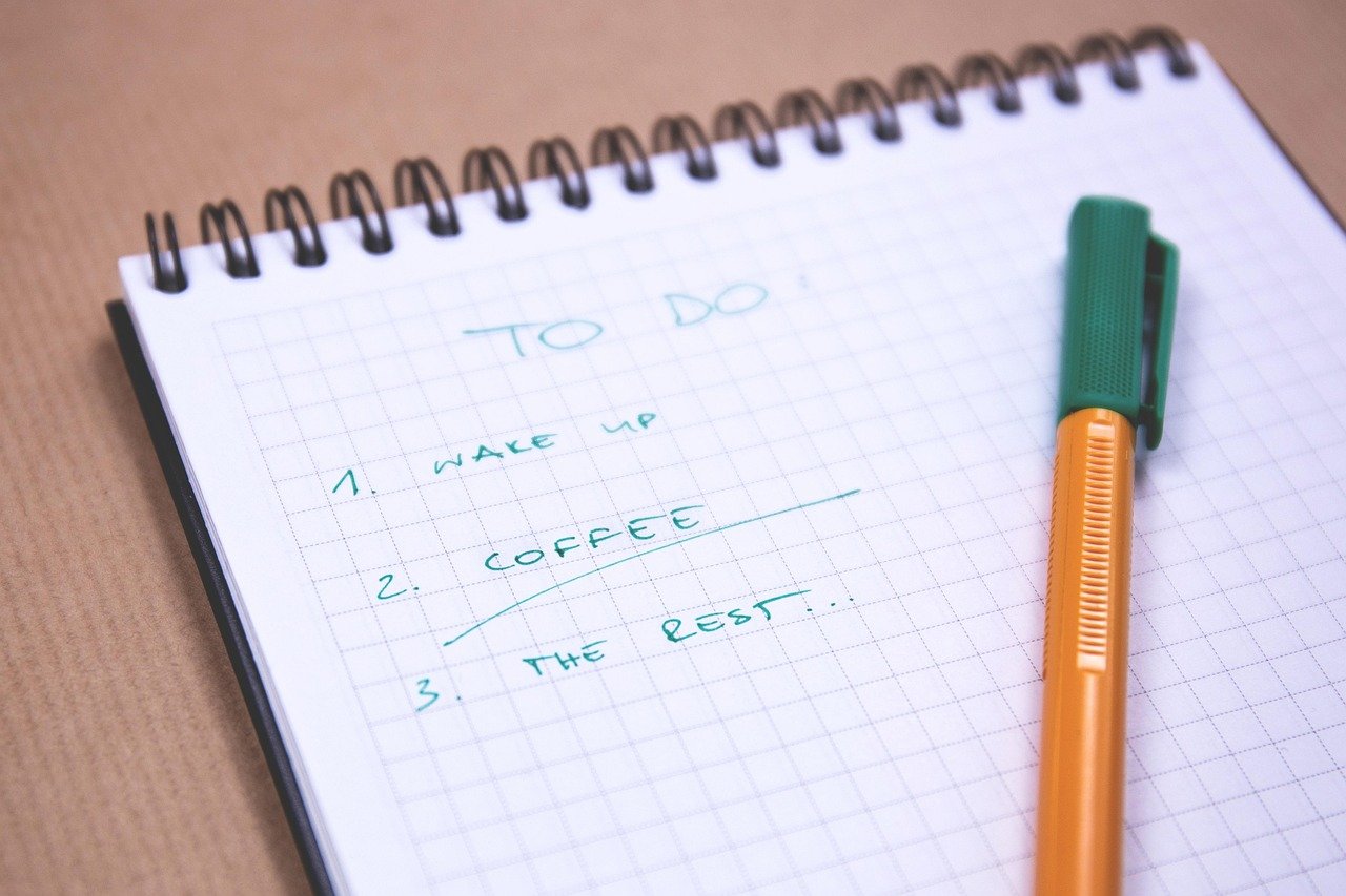 Handwritten shopping list in a notebook for Prime Big Deal Days