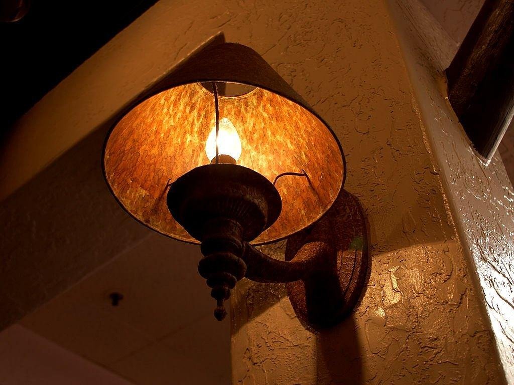 Warm wall light glowing in a cozy corner