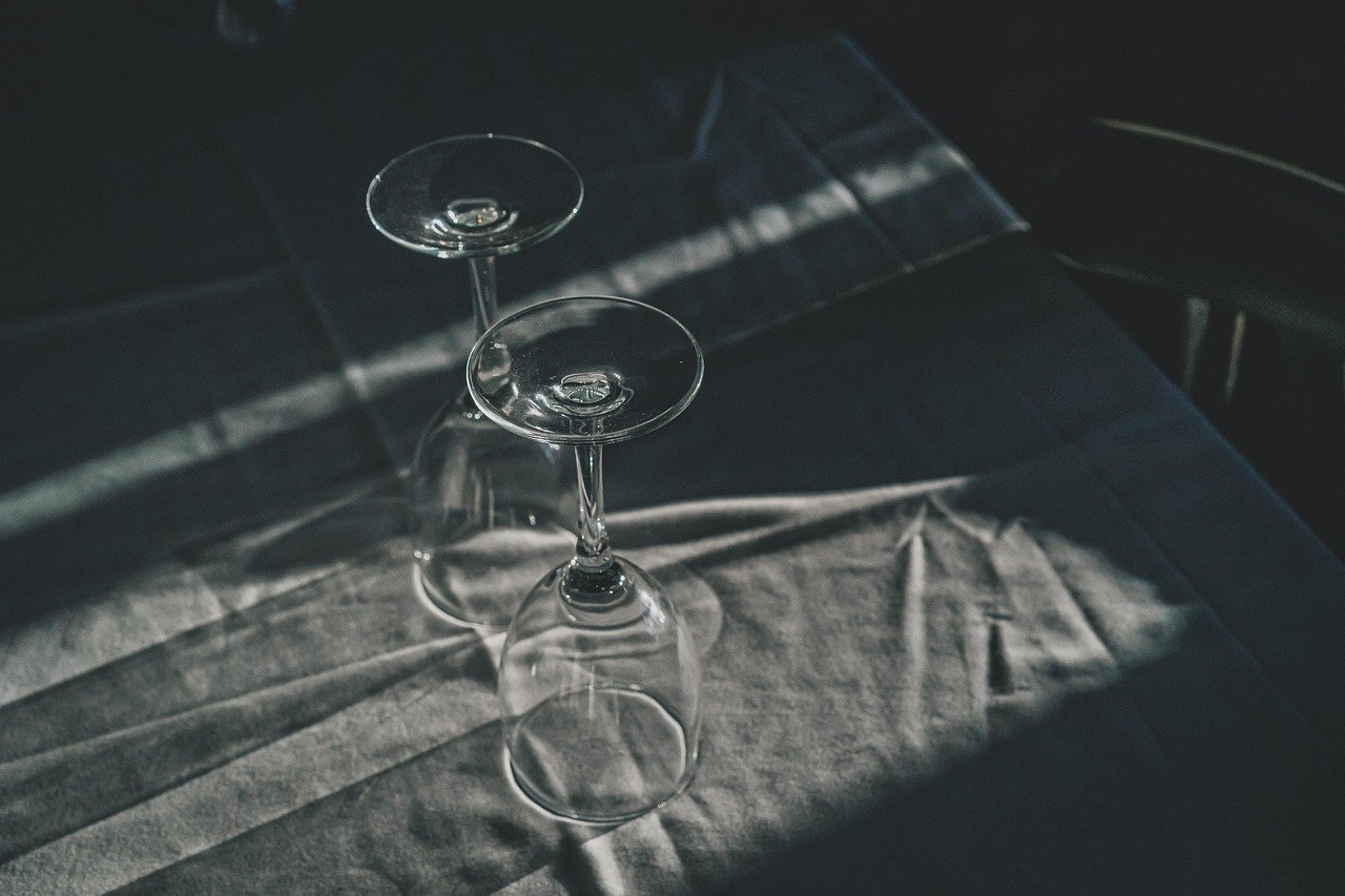 Thanksgiving dinner table set with glassware and place settings