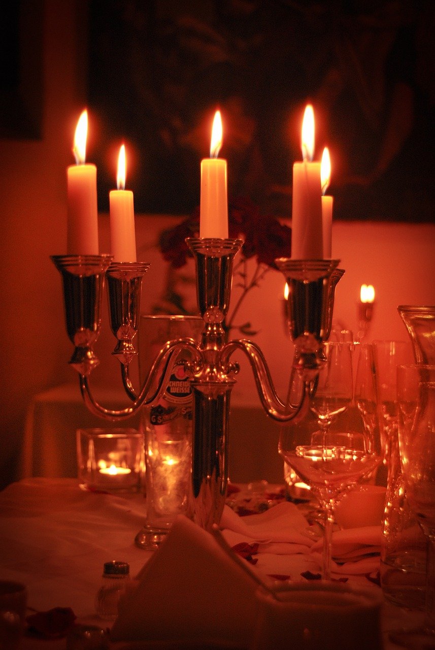 Dining table set for dinner with candles