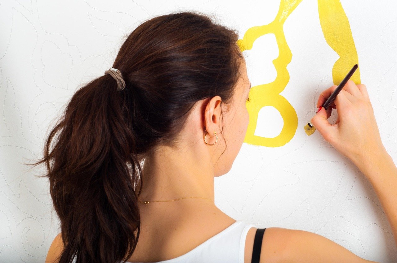 Painting a wall with a brush
