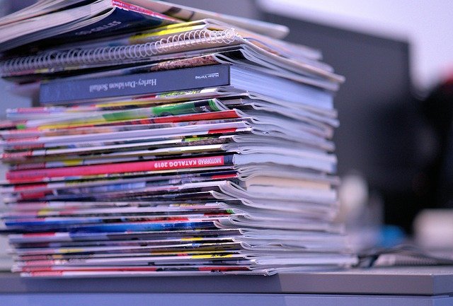 Stack of magazines organized in a holder