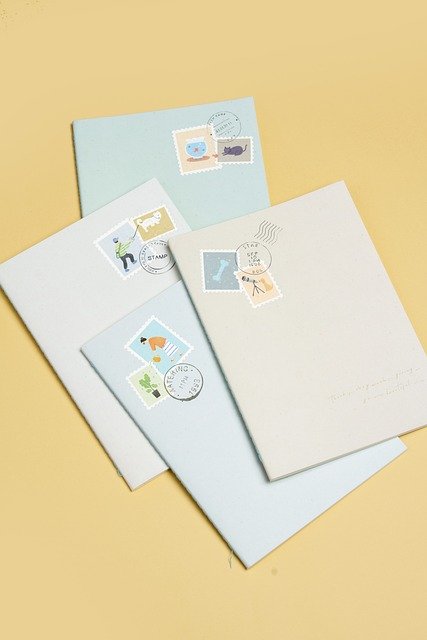 Sorting envelopes and papers into categorized piles