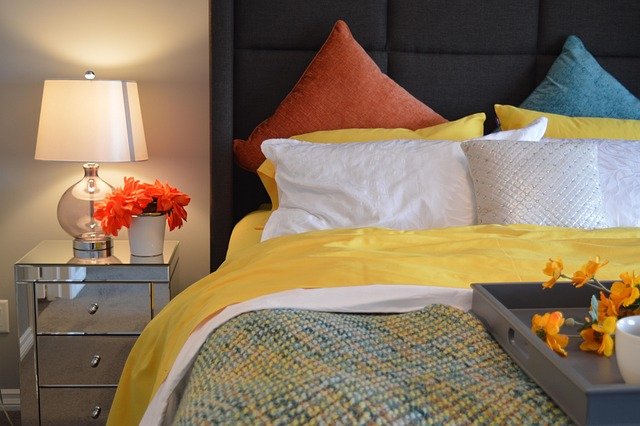 Bedroom with walls, trim, and ceiling painted the same saturated color