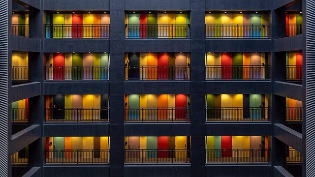 Colorful apartment building in a dense urban neighborhood